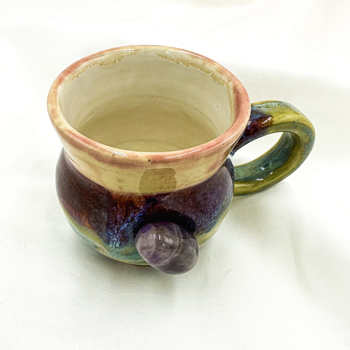 Magic mug with natural amethyst crystal