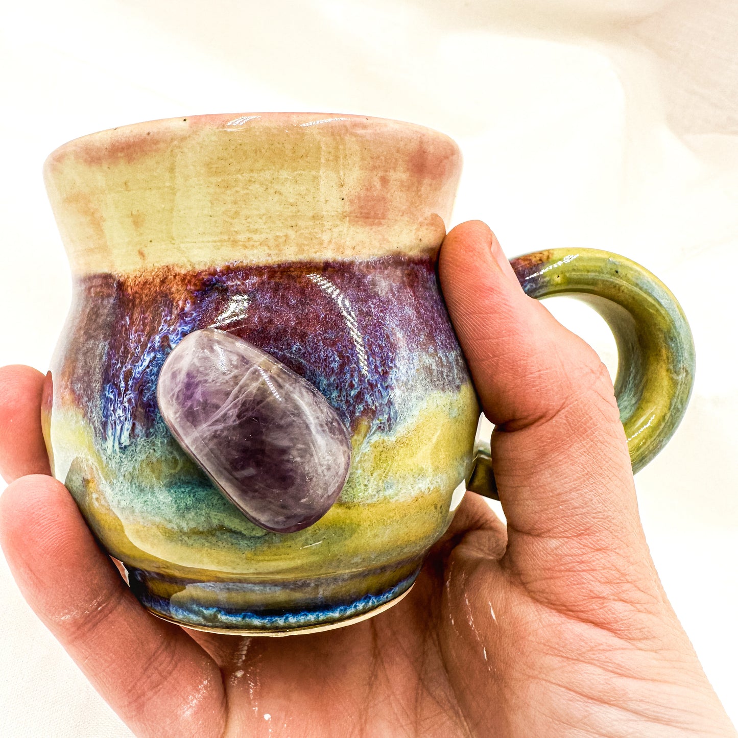 Magic mug with natural amethyst crystal