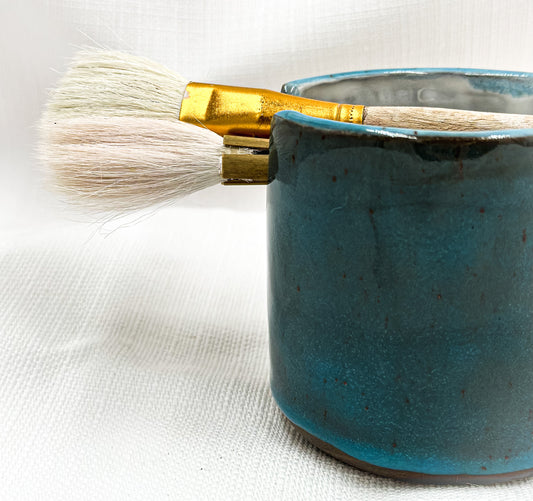 Big dark blue artist’s pot for brushes